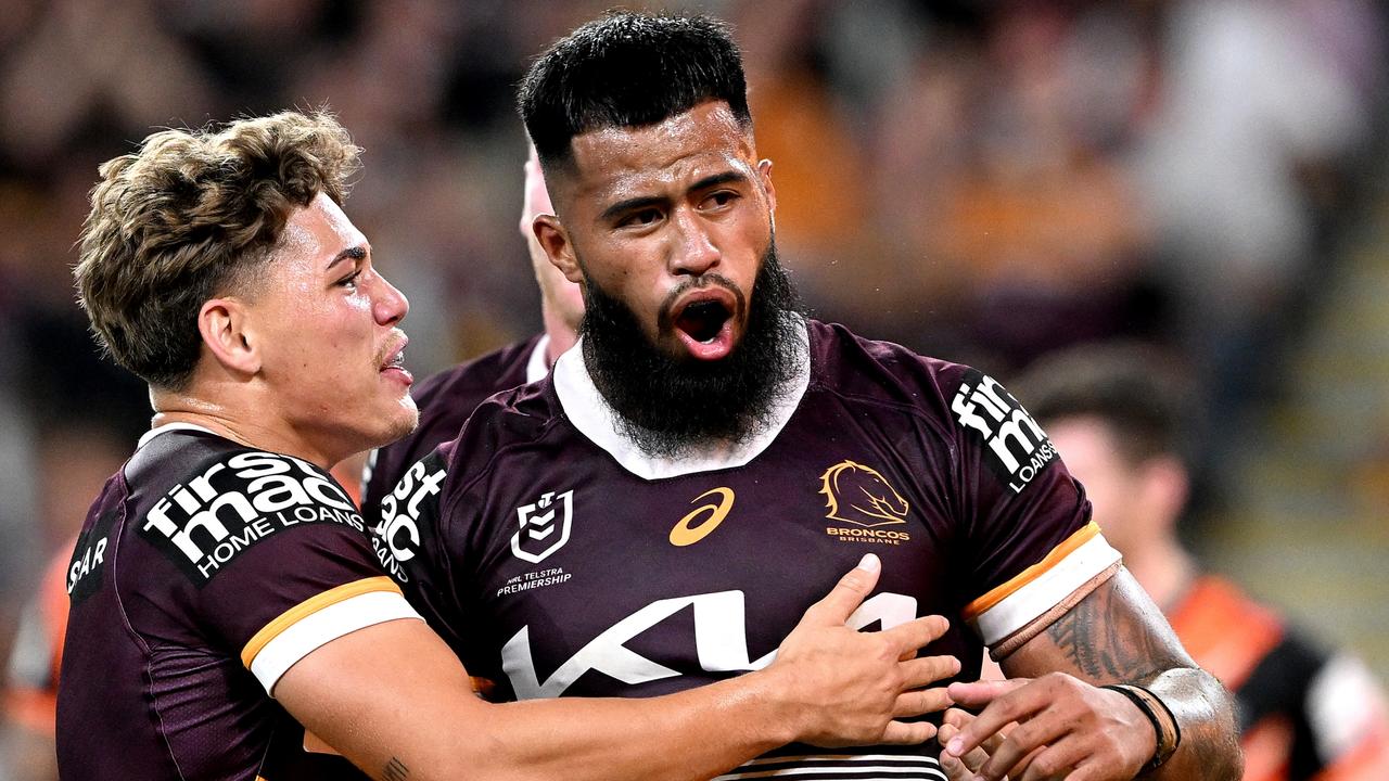 BRISBANE, AUSTRALIA - APRIL 01: Payne Haas of the Broncos celebrates with teammate Reece Walsh of the Broncos after scoring a try during the round five NRL match between Brisbane Broncos and Wests Tigers at Suncorp Stadium on April 01, 2023 in Brisbane, Australia. (Photo by Bradley Kanaris/Getty Images)