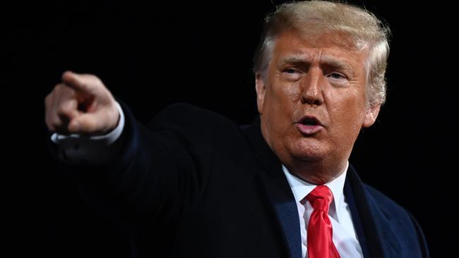 US President Donald Trump points at the end of a rally to support Republican Senate candidates at Valdosta Regional Airport in Georgia. Picture: AFP