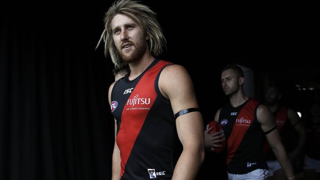 Essendon captain Dyson Heppell leads his team into battle.