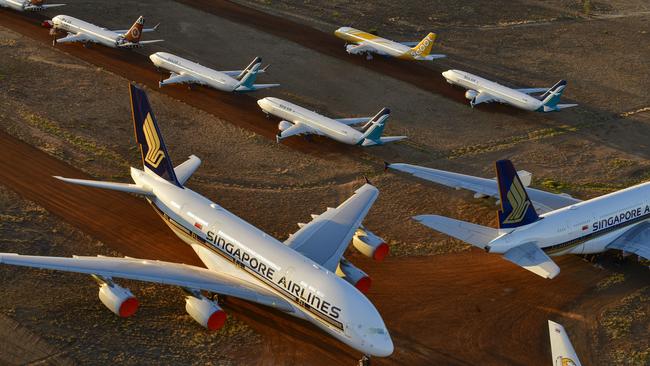 Grounded aeroplanes which include Airbus A380s, Boeing MAX 8s and other smaller aircrafts are seen at the Alice Springs aircraft storage facility on May 15, 2020. Picture: Getty Images