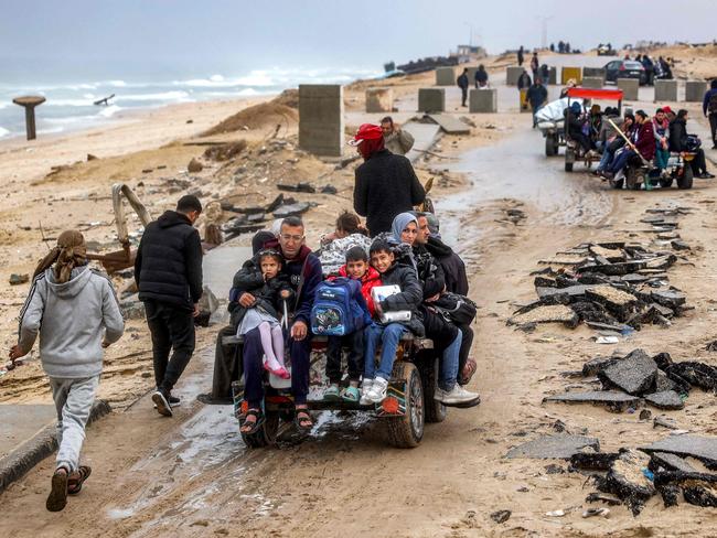 People ride in a horse-drawn cart between Gaza City and Nuseirat. Picture: AFP