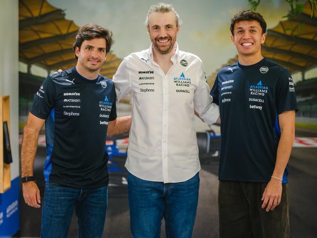 Atlassian CEO Mike Cannon-Brookes with Williams drivers Carlos Sainz and Alex Albon.