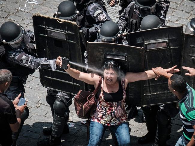 Rio de Janeiro state’s public servants protest against austerity measures in front of the Rio de Janeiro state Assembly (ALERJ), where lawmakers began discussing the measures promoted by the governor Luiz Fernando Pezao pushing budget cuts in response to nearly empty public coffers, in Rio de Janeiro, Brazil, on November 16, 2016. Picture: AFP PHOTO / YASUYOSHI CHIBA