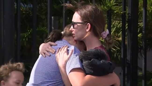 Parents comfort their children after the school shooting at Two Rocks, near Perth. Source: Nine News.