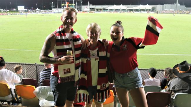 Despite barracking for the losing side, Daniel Scandolera, Carol Scandolera and Natalia Lepkowska from Cairns enjoyed the Cazalys Stadium experience for the premiership match between St Kilda and Port Adelaide on Saturday night. Picture: Andreas Nicola