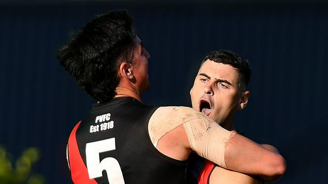 Paul Ahern of Pascoe Vale is congratulated by team mates after kicking a goal during the round two Strathmore Community Bank Premier Division Seniors match between Pascoe Vale and Strathmore at Raeburn Reserve, on April 20, 2024, in Melbourne, Australia. (Photo by Josh Chadwick)