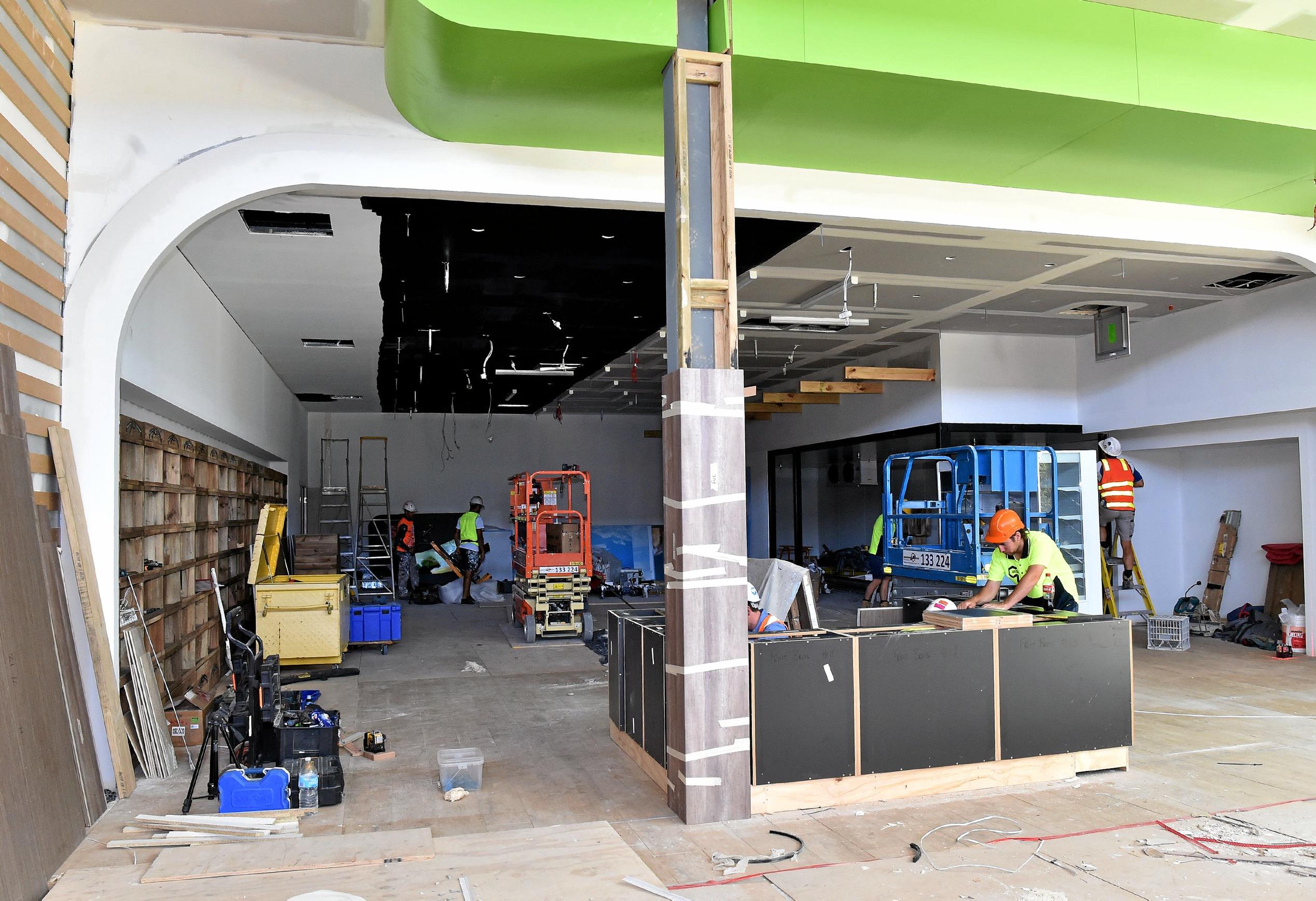 Full steam ahead for the opening of the Stockland Birtinya Shopping Centre. Constuction workers put the final pieces together for the grand opening in a couple of weeks. Picture: Warren Lynam