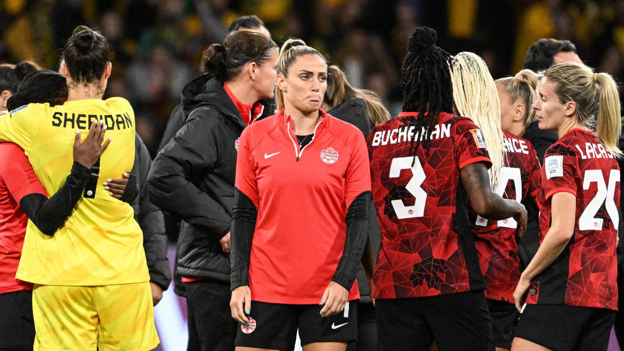 Canada’s players react to the defeat. (Photo by WILLIAM WEST / AFP)