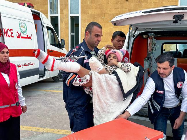 A girl is transferred after being injured.