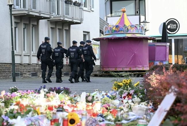 German police patrol after a knife attack that has added to a bitter debate over immigration