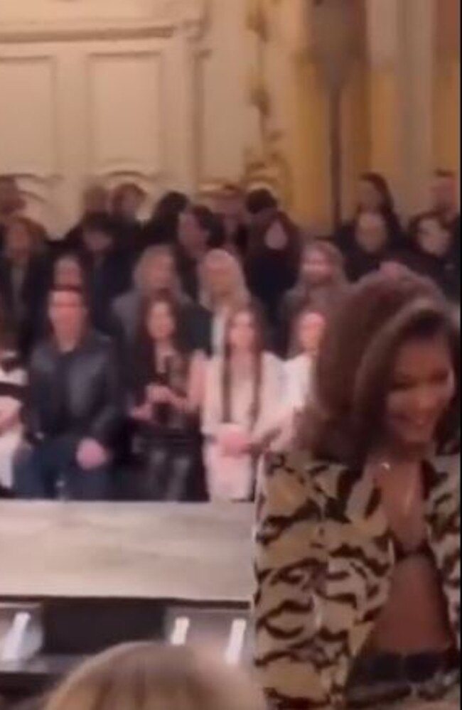 Zendaya arrives and takes her front row seat....