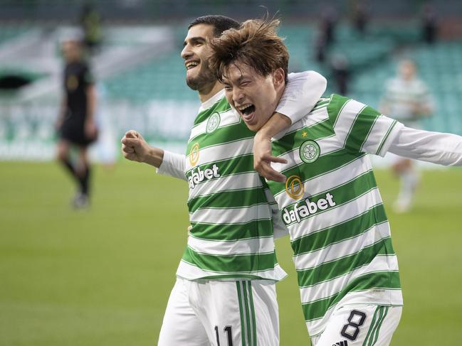 Kyogo Furuhashi (right) celebrates his hat-trick with Celtic teammate Liel Abada. Picture: Steve Welsh/Getty Images