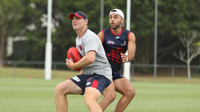 Christian Salem  does some one-on-one work with coach Simon Goodwin. Picture: Matthew Goodrope