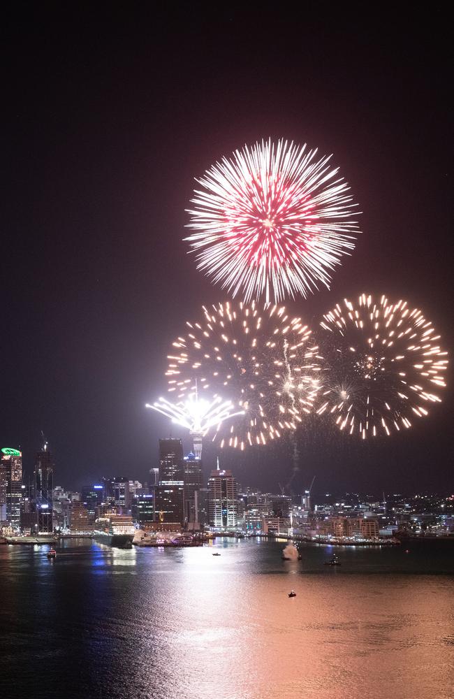 Fireworks are seen exploding from the Aucklands Waitemata Harbour and Sky Tower during the Auckland New Year's Eve celebrations. Picture: Getty