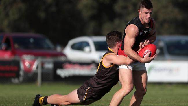 Bradyn Taglieri looks to shrug a tackle. Picture: Mark Dadswell/AAP