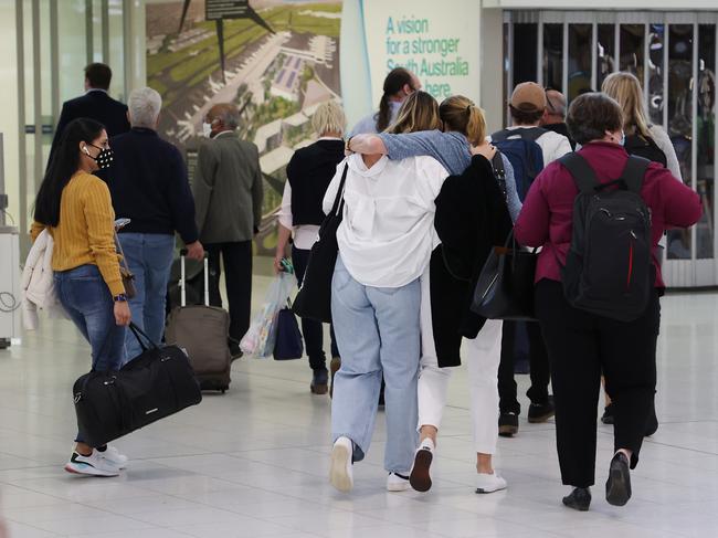 ADELAIDE, AUSTRALIA - NewsWire Photos NOVEMBER 23, 2021: People reuniting at Adelaide Airport on the first day of the border opening to the rest of the country . Picture: NCA NewsWire / David Mariuz