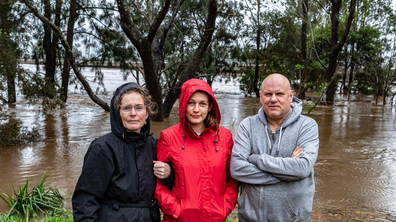 L-R Mel, Abigail and Mick Woods have experienced four floods since moving to Windsor in 2020. Picture: NCA NewsWire / Flavio Brancaleone