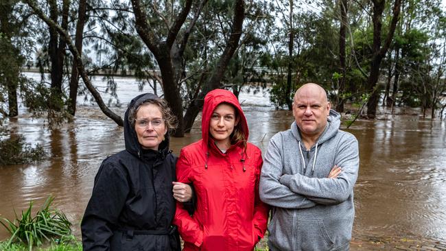 L-R Mel, Abigail and Mick Woods have experienced four floods since moving to Windsor in 2020. Picture: NCA NewsWire / Flavio Brancaleone