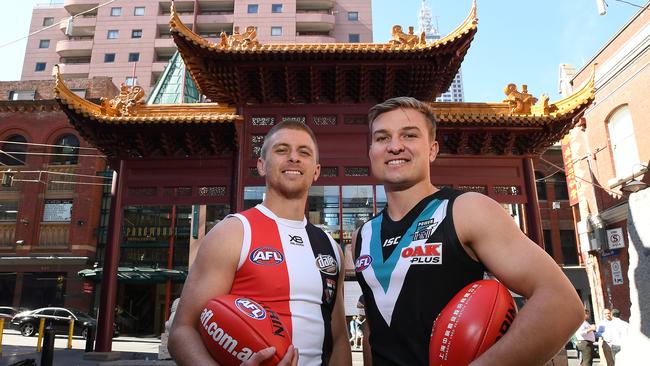 St Kilda’s Seb Ross and Port Adelaide skipper Ollie Wines after the Saints announced they will be the Power’s playing partner in China for the next three years. Picture: AAP Image/Julian Smith