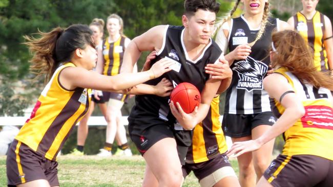 Ivanhoe onballer Kira Duroux tries to bullock her way through.   Picture: Phil Skeggs