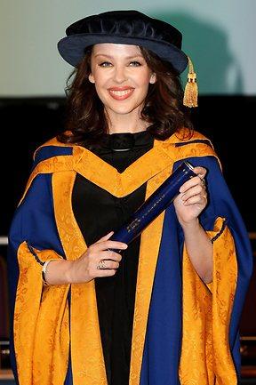 Minogue holds her honorary degree from Anglia Ruskin University in Chelmsford, England in October 2011in recognition of her work promoting breast cancer awareness after battling the disease. Picture: AP Photo/Chris Radburn/PA
