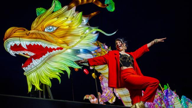 OzAsia Festival performer Parvyn with the new dragon lantern on the River Torrens footbridge. Picture: Mark Brake