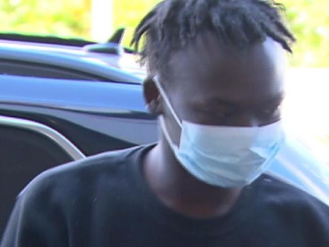 Stills of Mathiang Malok as he was taken through Melbourne Airport this morning  07/04/22. Operation Meld  Picture: 7NEWS