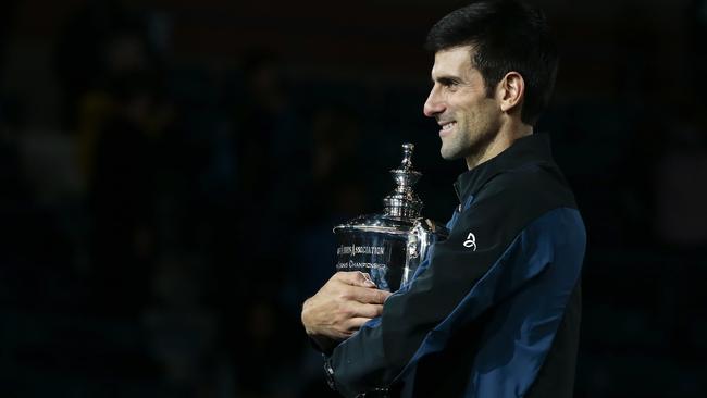 Novak Djokovic holds the championship trophy. Picture: AP