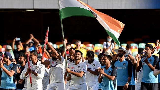 The Indian team does a lap of honour at the Gabba after their remarkable victory.