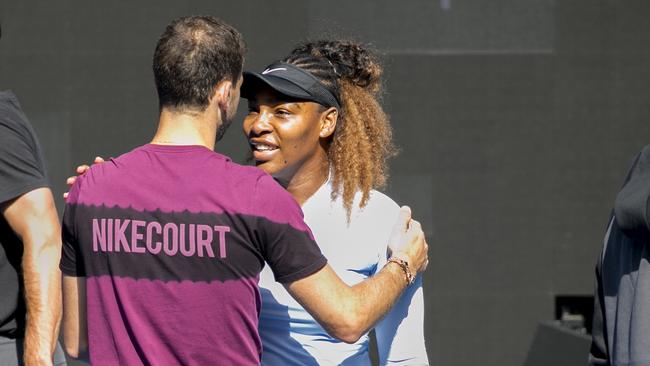 Grigor Dimitrov and Serena Williams hug it out after a ‘fiery’ practice session. Picture: AAP