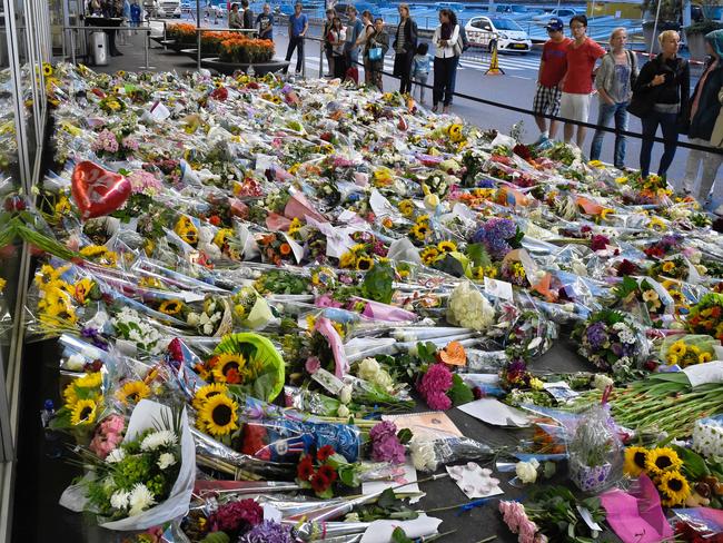 Outpouring of grief: Flowers placed in remembrance for the victims of the MH17 plane crash at Schiphol Airport, near Amsterdam. AFP PHOTO/JOHN THYS