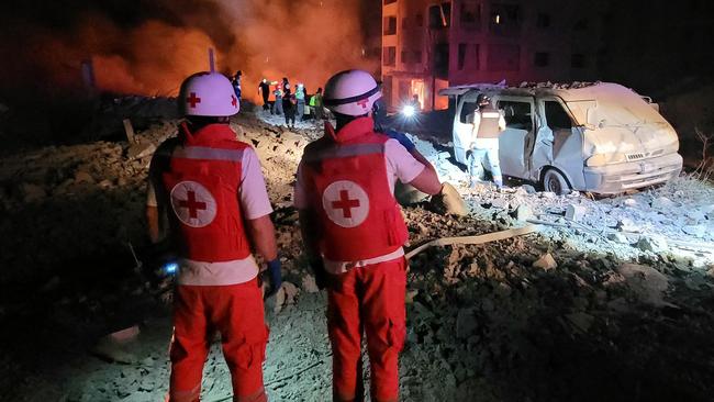 Responders arrive to the site of an Israeli airstrike that targeted the southern Lebanese village of Toul on October 15, 2024, amid the ongoing war between Israel and Hezbollah. (Photo by Abbas FAKIH / AFP)