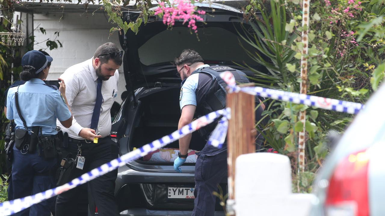 Police look over a car in the family’s driveway on Sunday. Picture: NCA NewsWire / Gaye Gerard