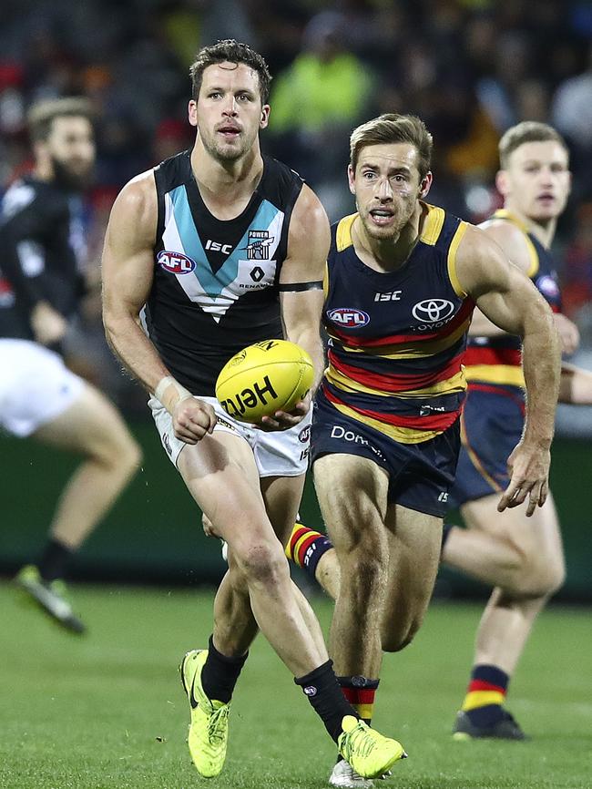 Port Adelaide’s Travis Boak and Adelaide’s Richard Douglas will battle again in Saturday’s Showdown. Picture Sarah Reed