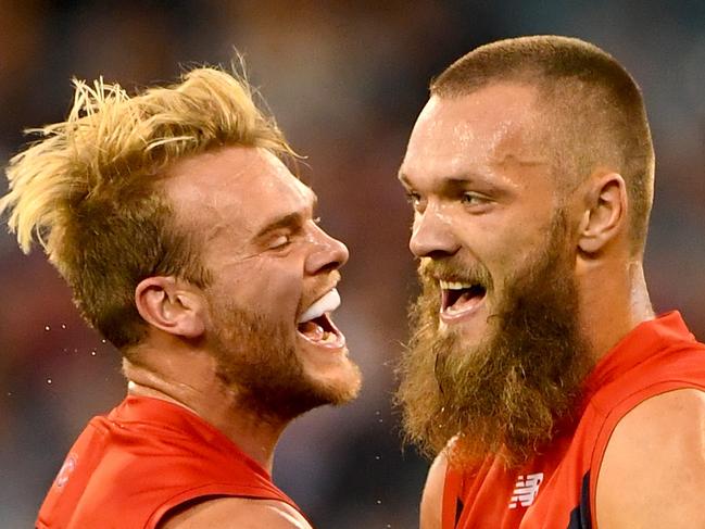 MELBOURNE, AUSTRALIA - APRIL 17: Jack Watts and Max Gawn of the Demons celebrates a goal during the round four AFL match between the Collingwood Magpies and the Melbourne Demons at Melbourne Cricket Ground on April 17, 2016 in Melbourne, Australia. (Photo by Quinn Rooney/Getty Images)