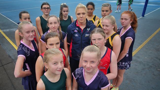 Kate Moloney of the Melbourne Vixens with young netballers at the SDNA courts on on Saturday, August 1, 2015, in Hampton, Victoria, Australia. Picture: Hamish Blair