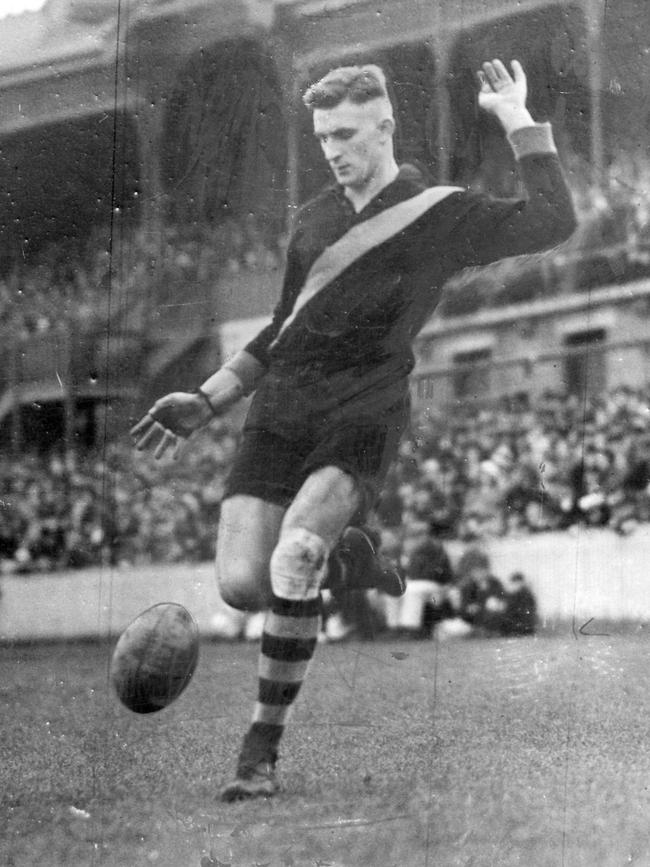 Doug Strang in action in front of the stand at Punt Road Oval in 1934. The stand is now known as the Jack Dyer stand.