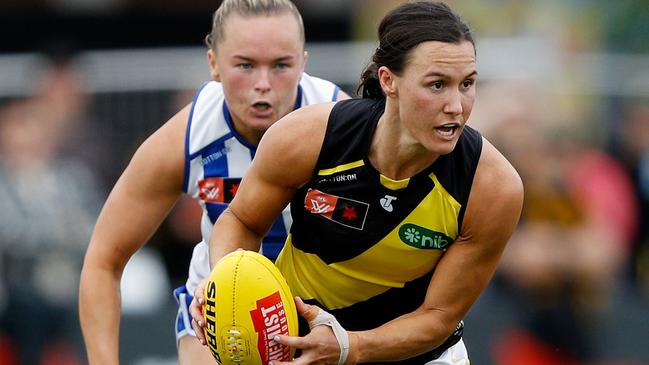 Eilish Sheerin looks to offload as the Tigers and the Kangaroos battled out a thrilling draw. Picture: Dylan Burns/AFL Photos via Getty Images