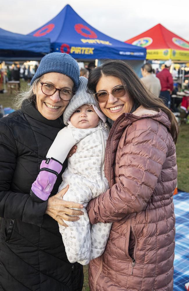 Three generations (from left) Olga Rivero, Martina Garcia and Maria Bidirinis rug up to support solo runner Roberto Garcia in the 40 for Fortey at Toowoomba Showgrounds, Sunday, June 2, 2024. Picture: Kevin Farmera