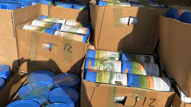 Thousands of baby formula tins seized by police. Picture: NSW Police