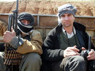 Time correspondent Michael Ware with a guard on the Iraqi front linesbetween Shorish and Kirkuk.