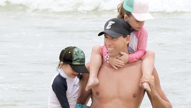 Grant Hackett on the beach at Miami with his kids Charlize and Jagger. Pic by Luke Marsden.