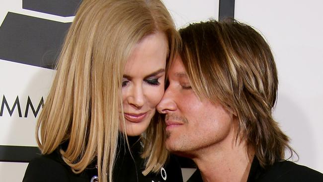 Nicole Kidman, Keith Urban and their respective blow dries shared an intimate moment on the red carpet at the Grammy Awards earlier this month. Photo: Dan MacMedan/WireImage.