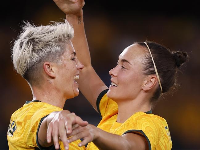 MELBOURNE, AUSTRALIA - FEBRUARY 28: Michelle Heyman of the Matildas celebrates a goal with team mare Caitlin Foord during the AFC Women's Olympic Football Tournament Paris 2024 Asian Qualifier Round 3 match between Australia Matildas and Uzbekistan at Marvel Stadium on February 28, 2024 in Melbourne, Australia. (Photo by Darrian Traynor/Getty Images)