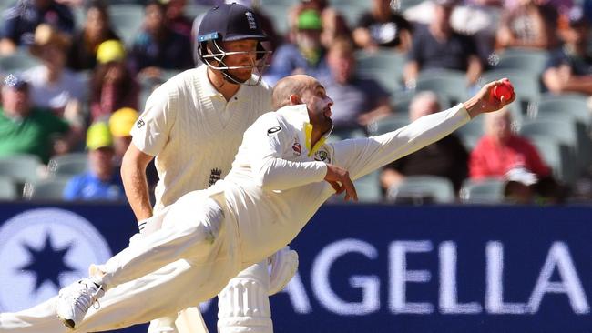 Nathan Lyon launches himself to remove England’s Moeen Ali.