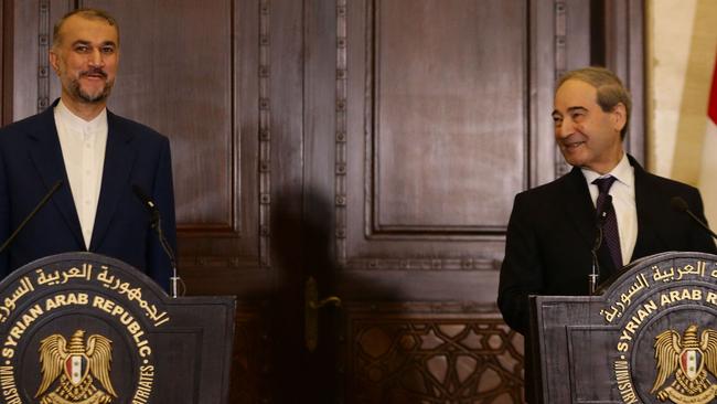 Iranian Foreign Minister Hossein Amir-Abdollahian (L) and his Syrian counterpart Faisal Mekdadspeak to reporters. Picture: AFP.