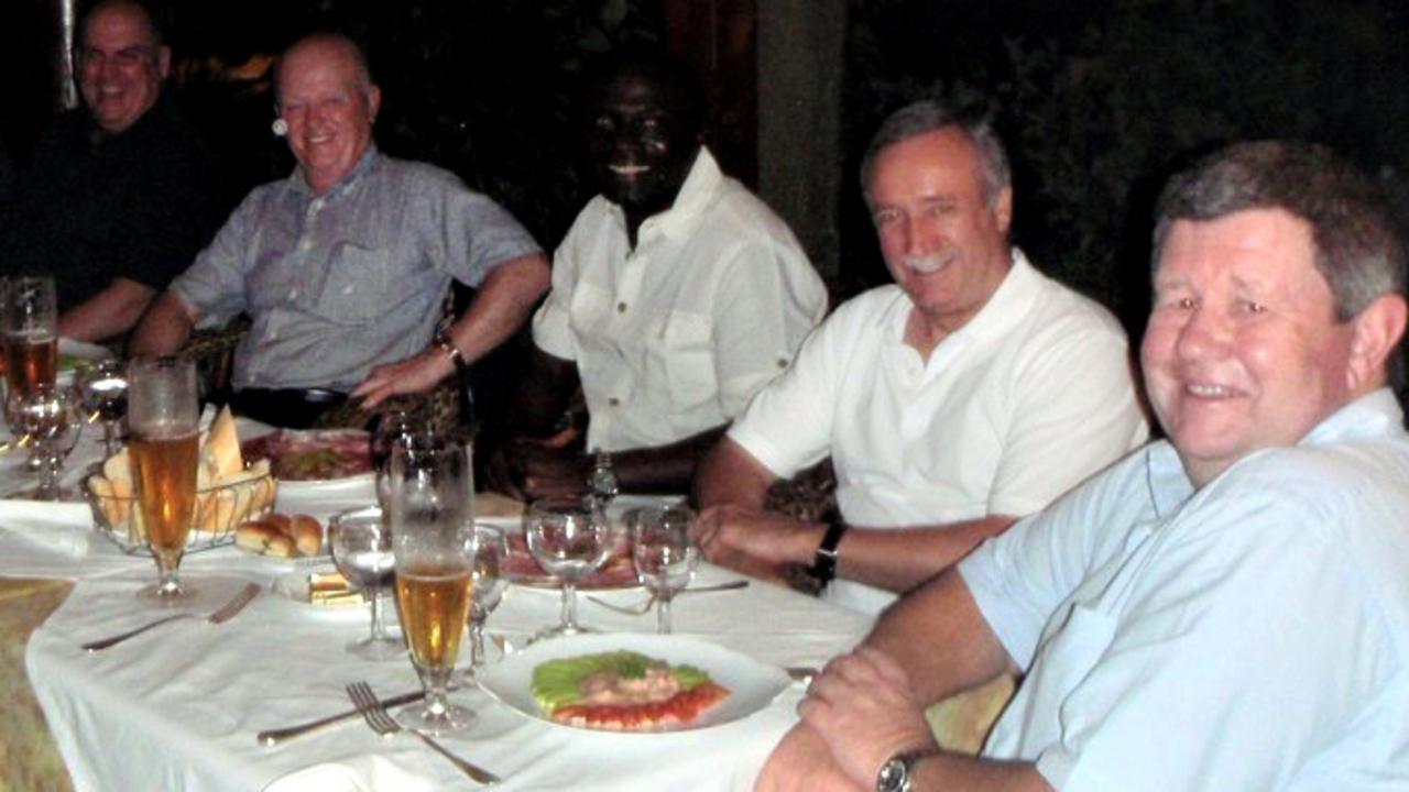 Ken Talbot pictured at dinner with his fellow travellers before his death.