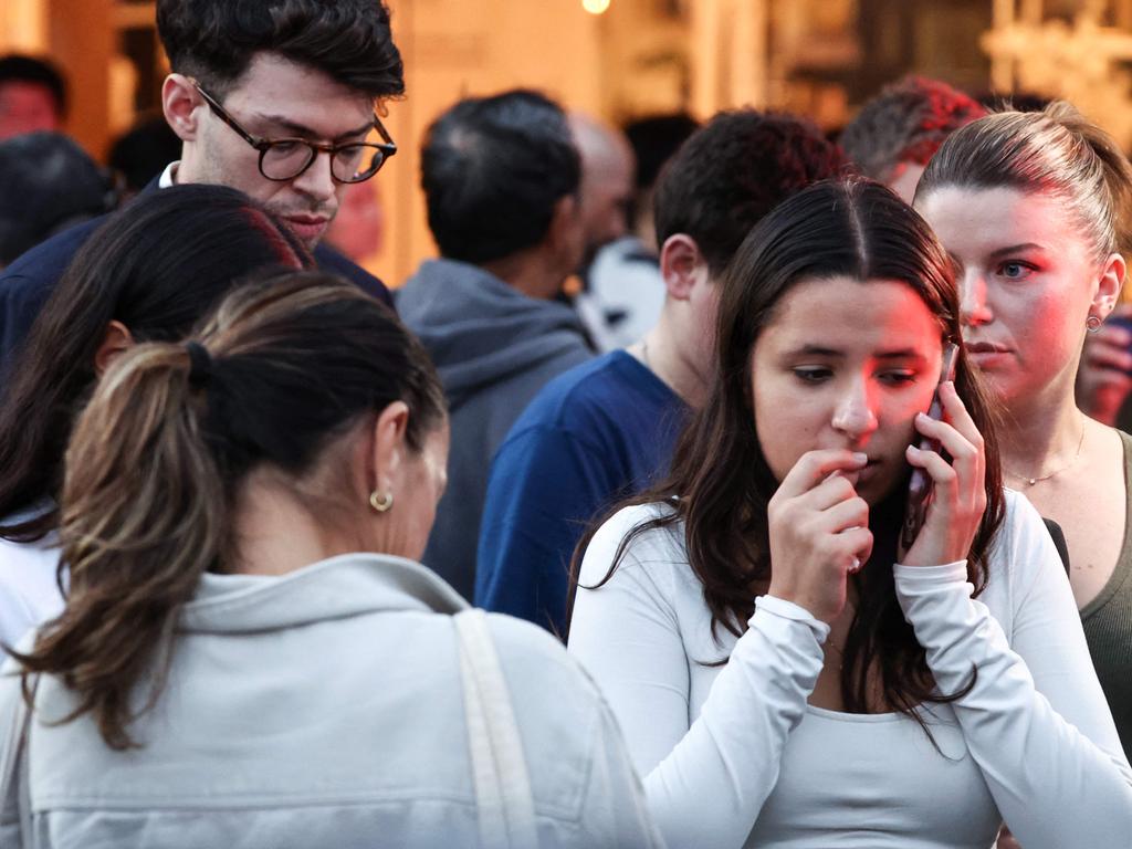 People gather outside Westfield Bondi Junction shopping mall after a massacre in Sydney on April 13, 2024. Picture: AFP.