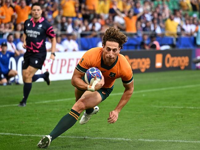 Nawaqanitawase dives for the line as he scores Australia's first try of the game against France in the 2023 Rugby World Cup. Picture: Olivier CHASSIGNOLE / AFP