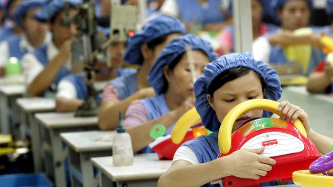 Chinese factory assembly line workers at toy cars production of Da Lang Wealthwise Plastic factory in Dongguan, China.